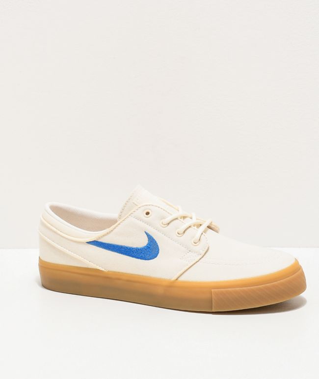 white and blue nike sb